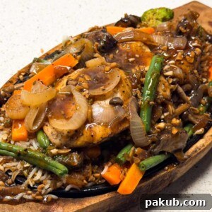 chicken sizzler served n a sizzling tray ready to eat