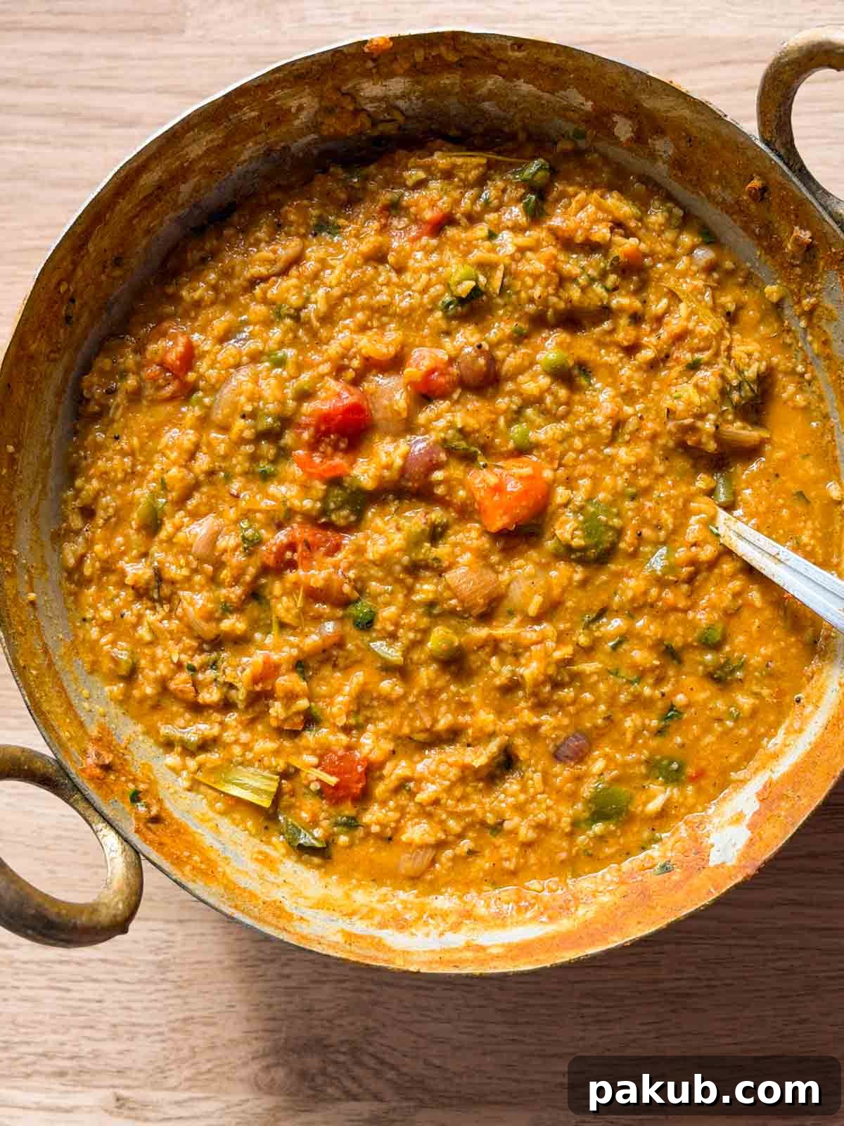 Bisi Bele Bath Recipe: Authentic Karnataka Lentil Rice 2 freshly made bisi bele bath still in the kadai