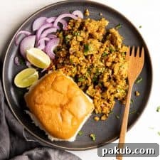 Street style egg bhurji served on a plate with pav