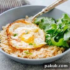 Savory Garlic Oats with served with Masala Fried Egg and basil- a lip-smacking breakfast.