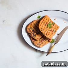 Masala french toast served from a large white plate.
