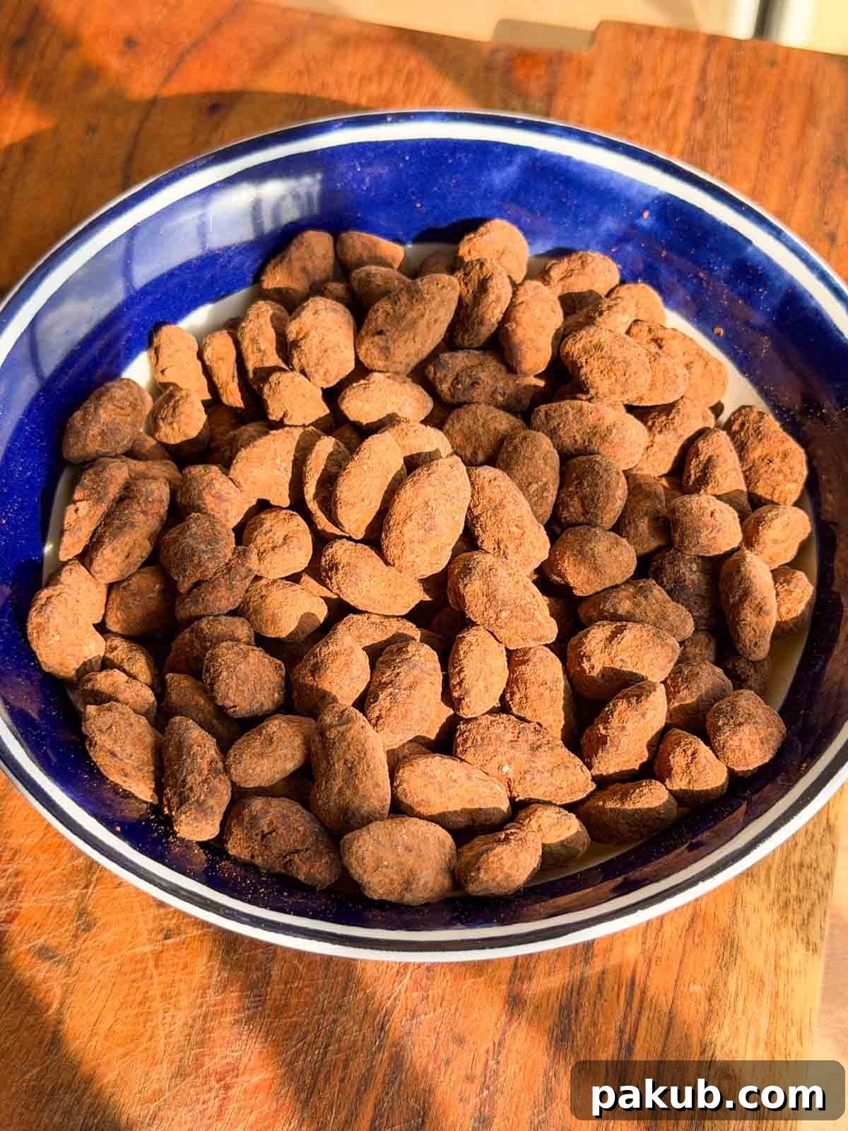 Air Fryer Chocolate-Covered Almonds Recipe 2 chocolate covered almonds in a bowl
